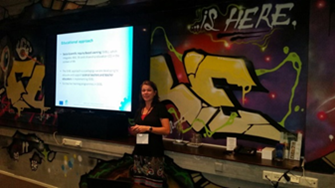 Figure 1. Dr. Christine Knippels introduces the symposium and the presenters