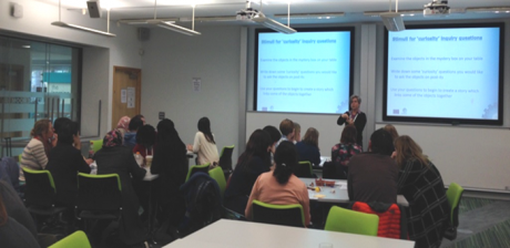 Figure 1. Ruth discussing curiosity questions with participants.